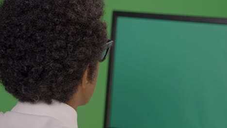 CU-Businessman-Looking-at-Computer-on-Green-Screen
